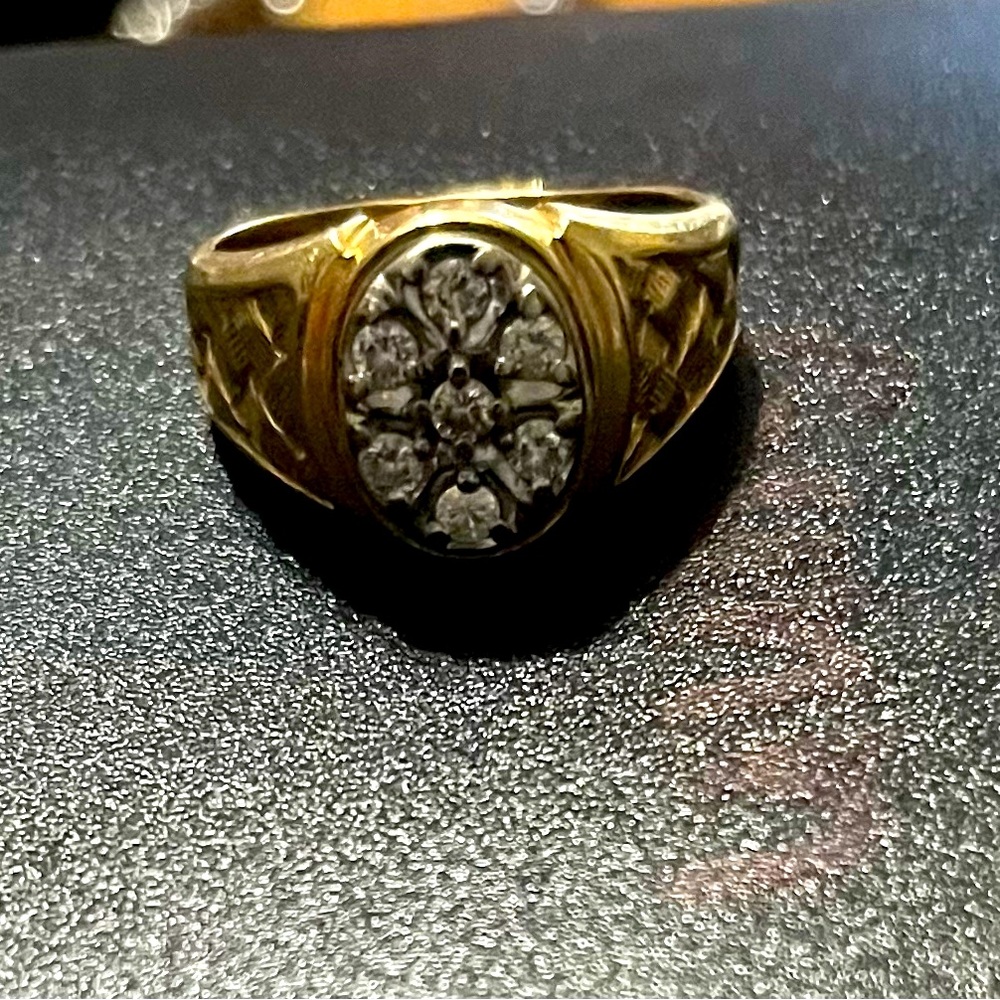 Men’s 14k yellow gold and 1/2 karat in 1/8karat individual diamonds.